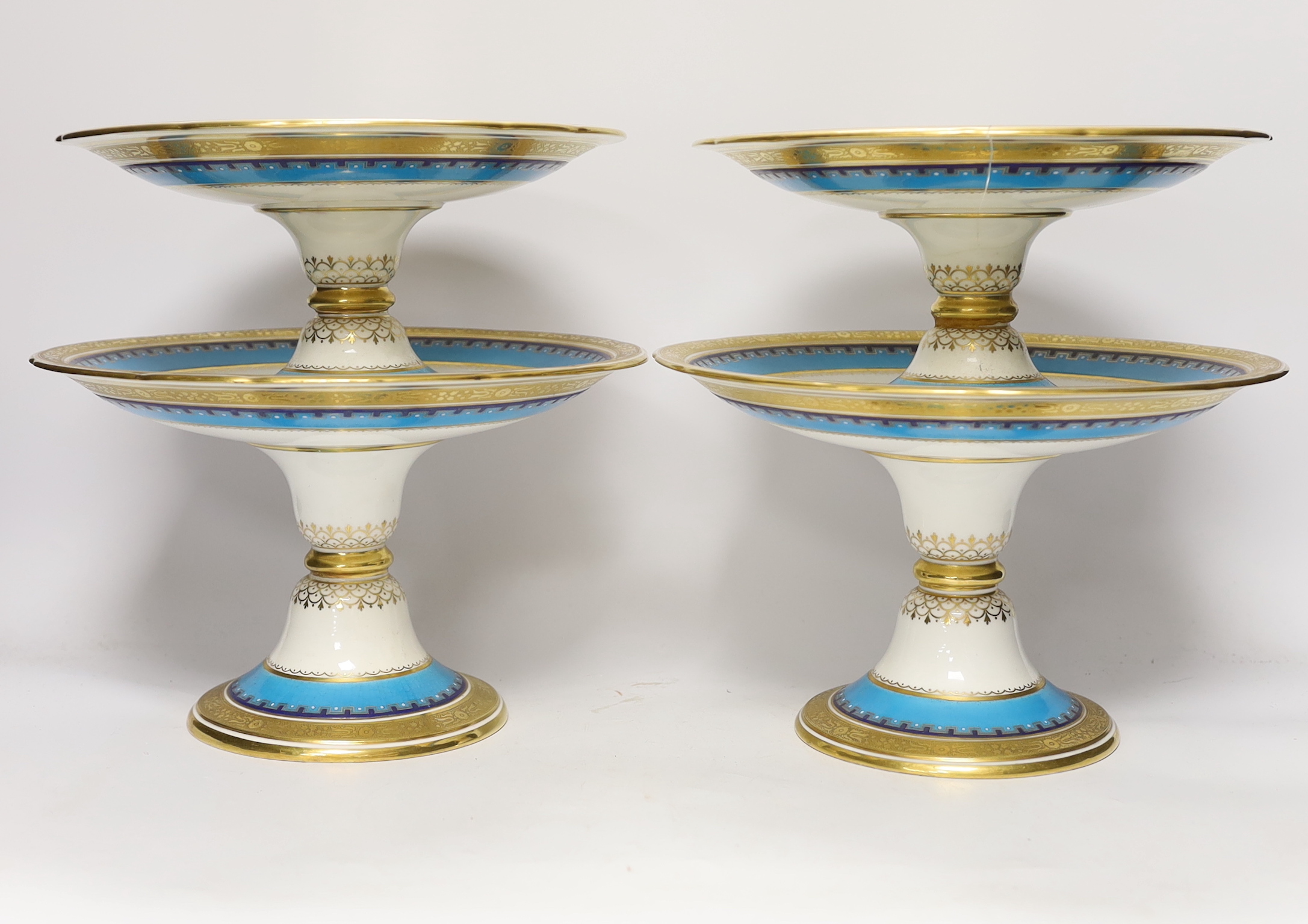 A 19th century Minton porcelain dessert service with gilt and floral decoration, twelve plates and two pairs of various height comports, tallest 16.5cm high